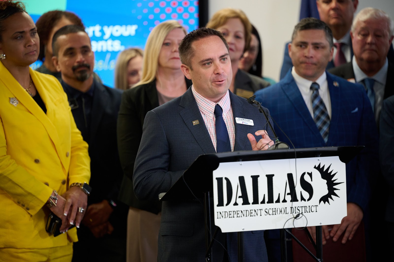 plano economic development director doug mcdonald speaking at podium